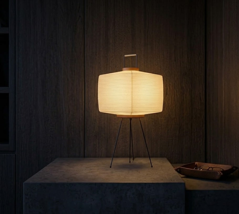 Triangular table lamp with a warm light on a dark wooden background
