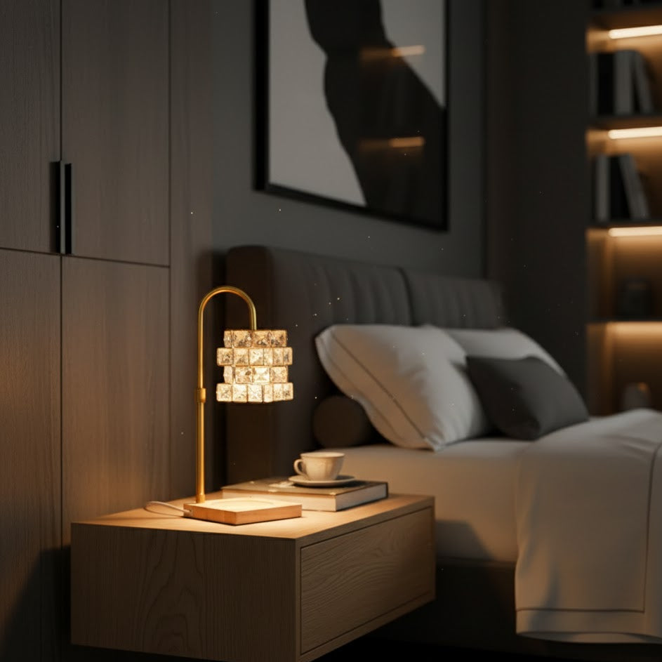 Modern bedroom with a nightstand, lamp, and bed in a dimly lit roo