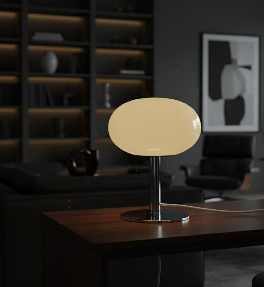 Beige table lamp on a wooden surface with a blurred background